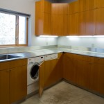 Laundry room with built-in Miele washer and dryer; Doug Fir cabinets